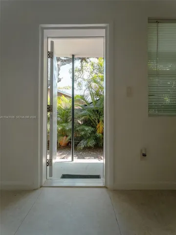 a view of a backyard with pathway