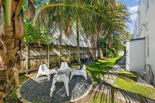 a view of a lake with a palm tree