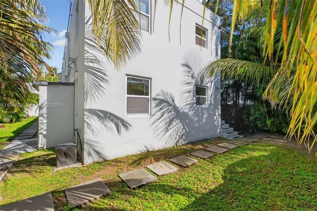 a view of a backyard with plants