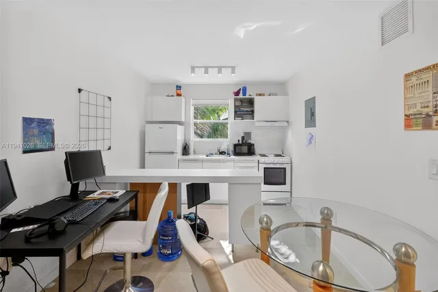 a room with a couch and a workspace