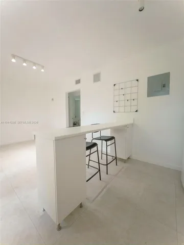 a view of workspace and livingroom with furniture