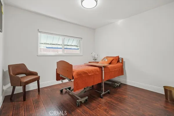 a room with chairs and wooden floor