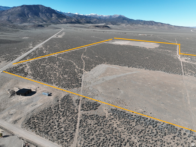 Undisclosed Address Junction, UT 84740 - Photo 6 of 9 View of rural area featuring a mountain backdrop and property boundaries highlighted