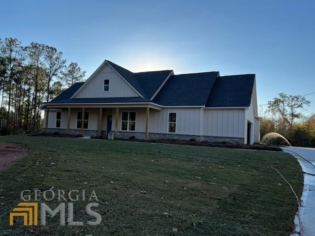 1724 Brownlee Road Jackson, GA 30233 - Photo 1 of 1 a front view of a house with a garden