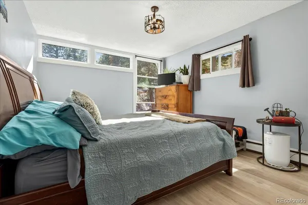 a bedroom with a bed and cabinets