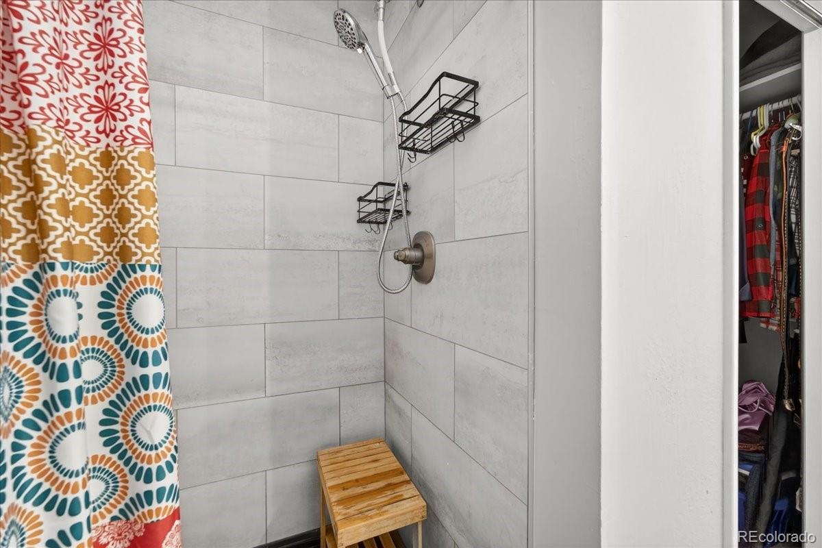 11827 Brook Road Golden, CO 80403 - Photo 15 of 32 a bathroom with a shower