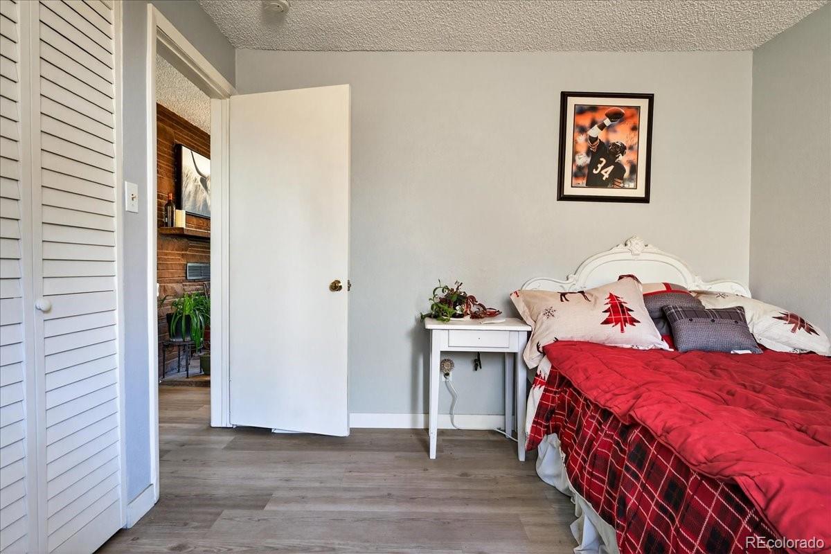 11827 Brook Road Golden, CO 80403 - Photo 18 of 32 a bedroom with a bed and a cabinets
