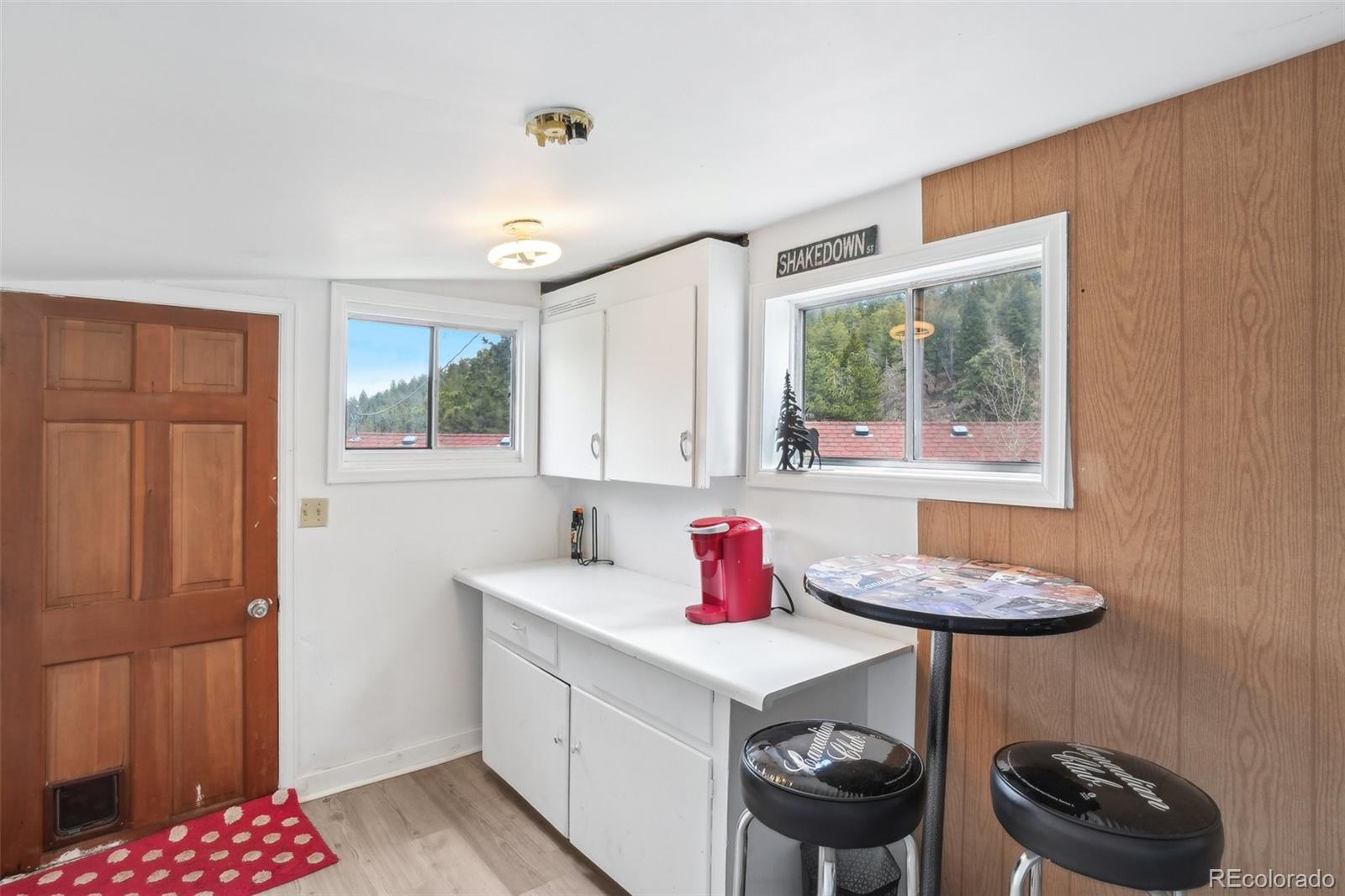 11827 Brook Road Golden, CO 80403 - Photo 20 of 32 a kitchen with a sink a stove and a window
