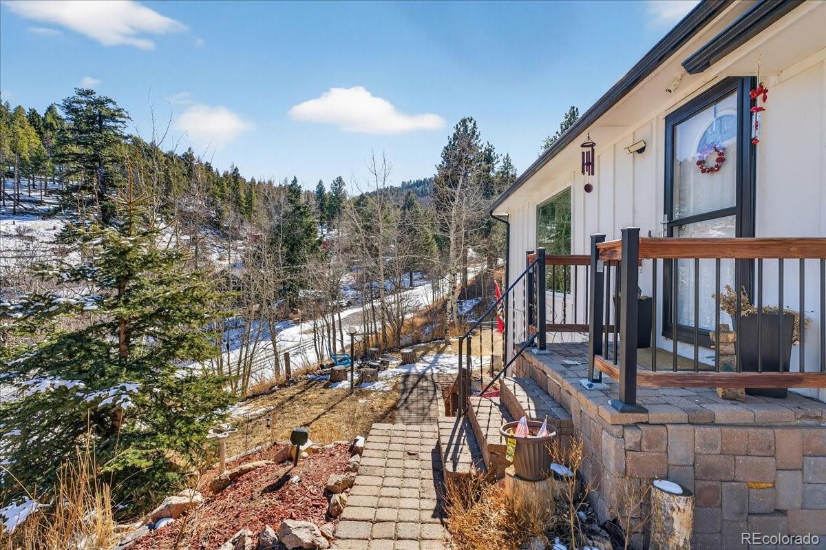 11827 Brook Road Golden, CO 80403 - Photo 2 of 32 a view of a balcony with furniture