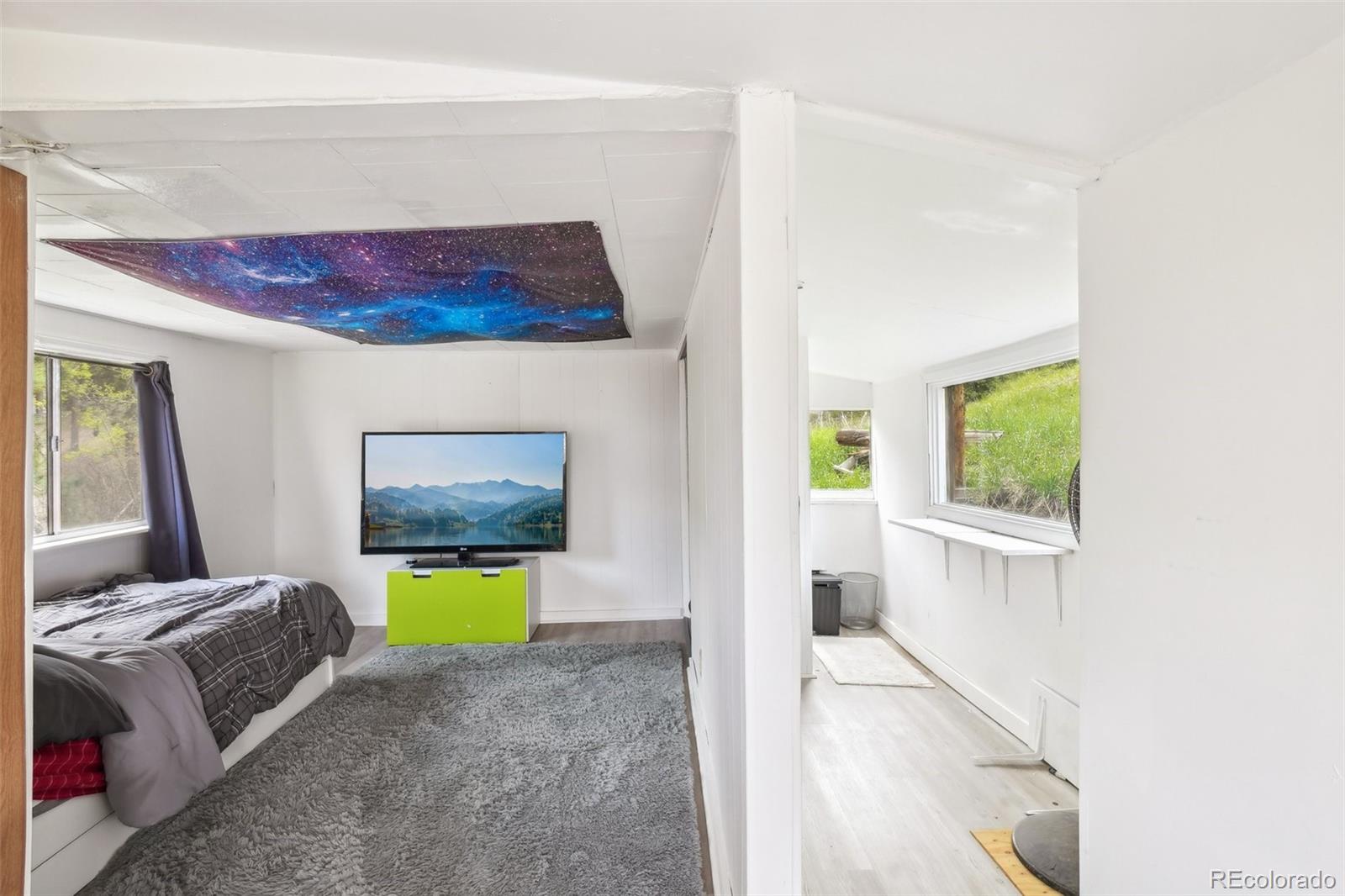 11827 Brook Road Golden, CO 80403 - Photo 23 of 32 a living room with furniture and a window