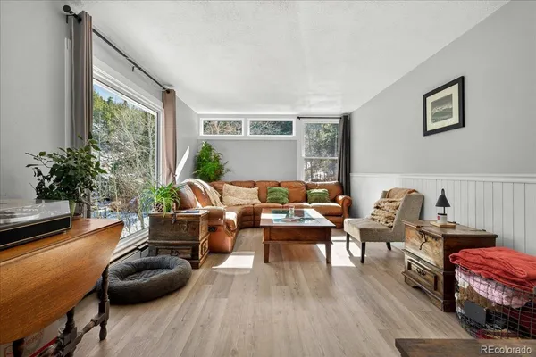 a living room with furniture and a window