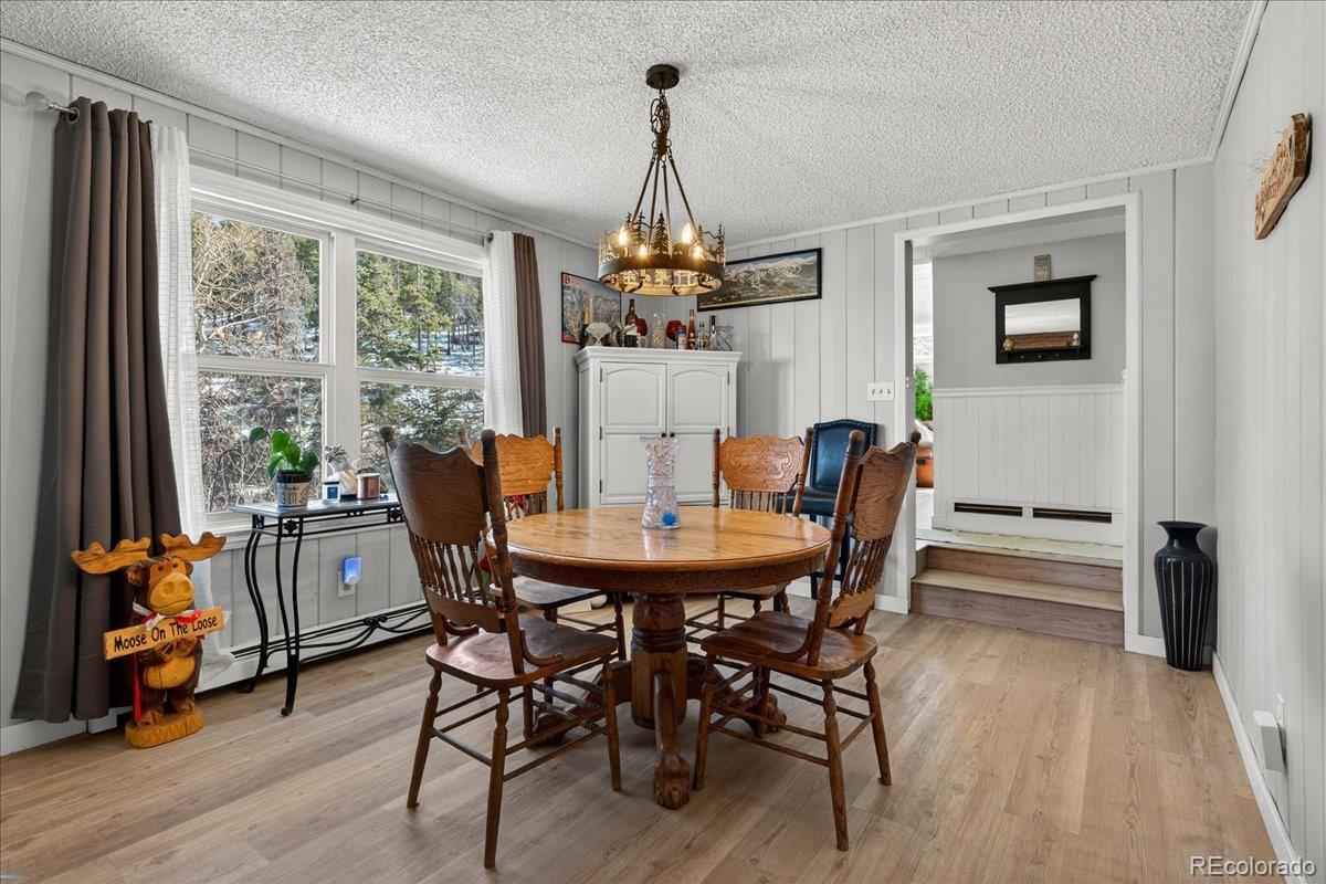 11827 Brook Road Golden, CO 80403 - Photo 6 of 32 a view of a dining room with furniture window and outside view