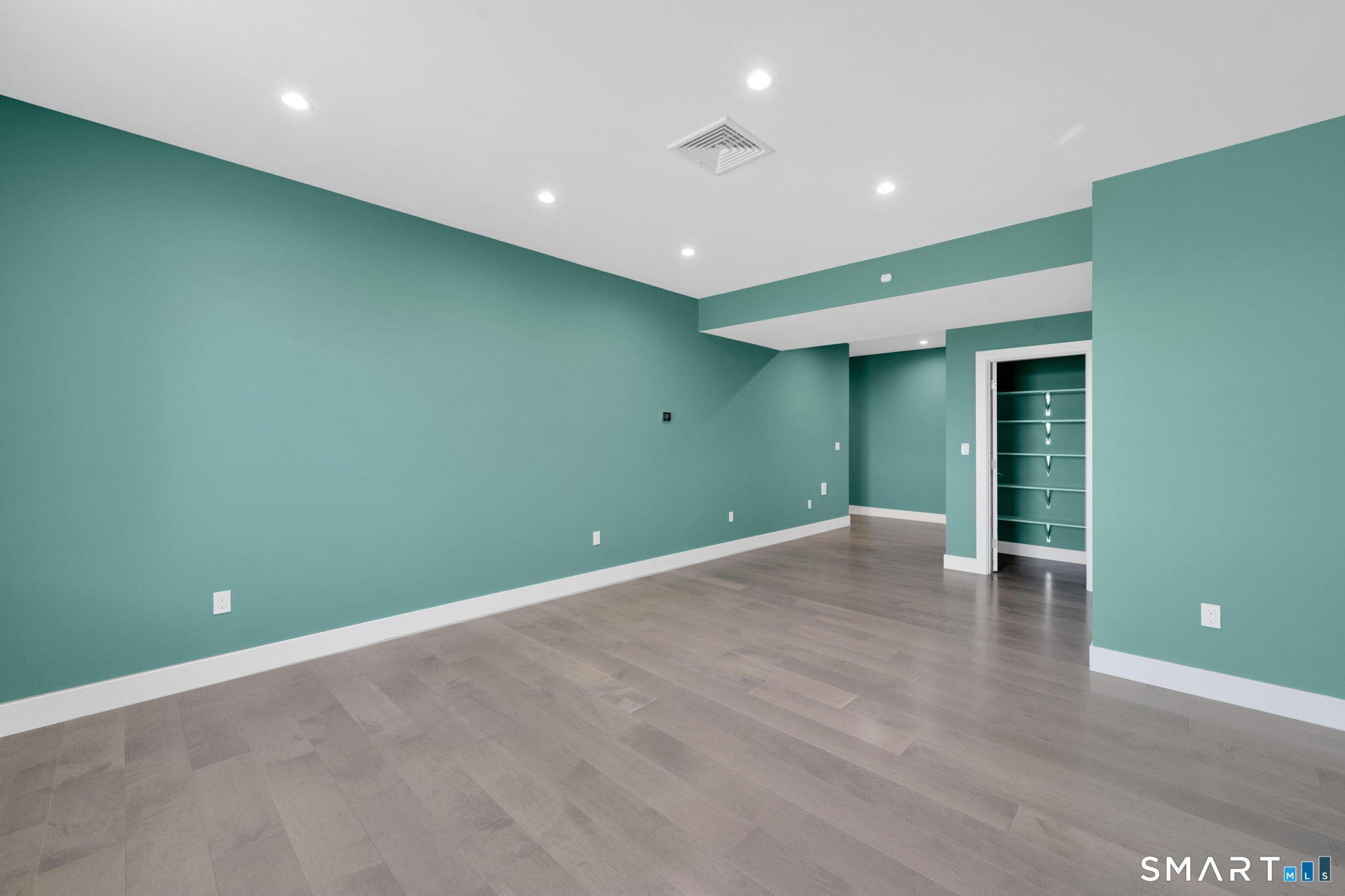 62 Pinnacle Road Farmington, CT 06032 - Photo 32 of 40 a view of an empty room with wooden floor