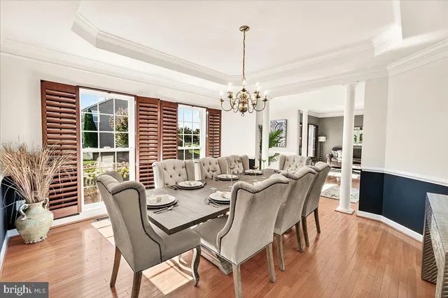 a living room with furniture wooden floor and a fireplace