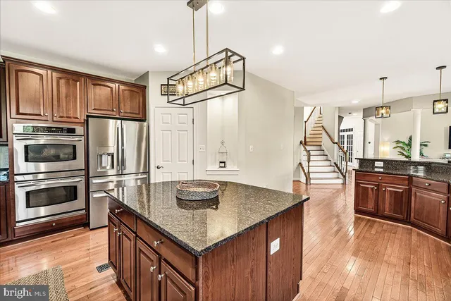 a spacious bedroom with a bed and a cabinets