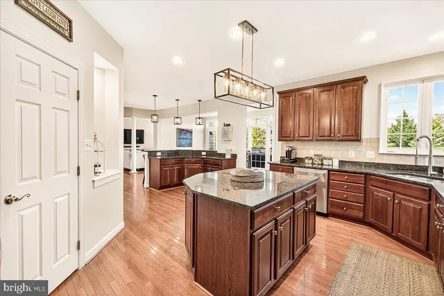 a spacious bedroom with a bed and ceiling fan