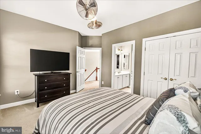 a view of a house with a big yard and large trees