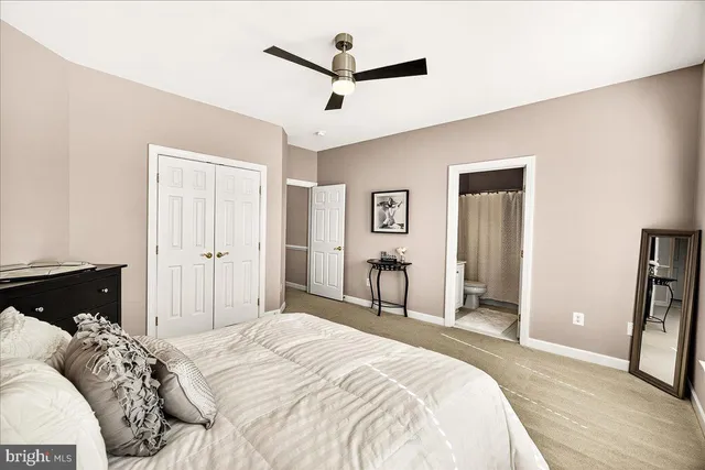 a view of a house with a big yard and large trees