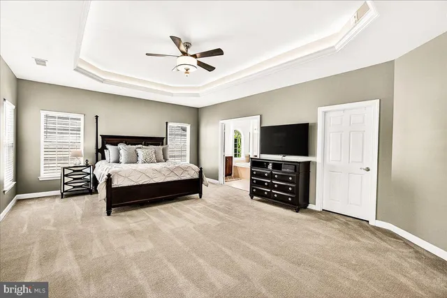 a view of a house with a backyard and a garden