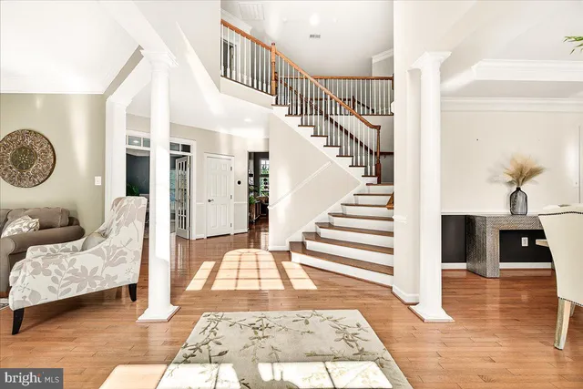 a view of a dining room with furniture and chandelier