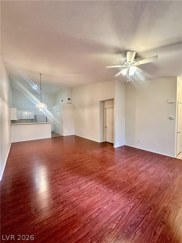2053 Turquoise Ridge Street, Unit 202 Las Vegas, NV 89117 - Photo 1 of 18 Rich wood-look flooring anchors this open living space leading directly into the kitchen.