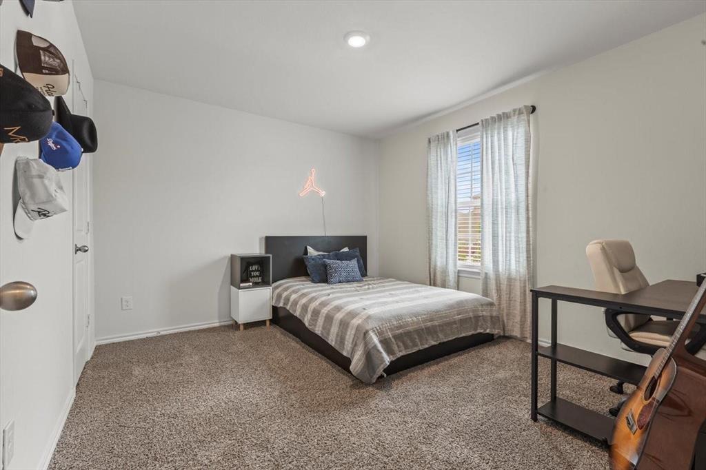 113 Keller Road Royse City, TX 75189 - Photo 13 of 25 a bedroom with a bed and a window
