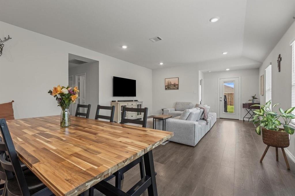 113 Keller Road Royse City, TX 75189 - Photo 19 of 25 a dining room with furniture potted plants and wooden floor