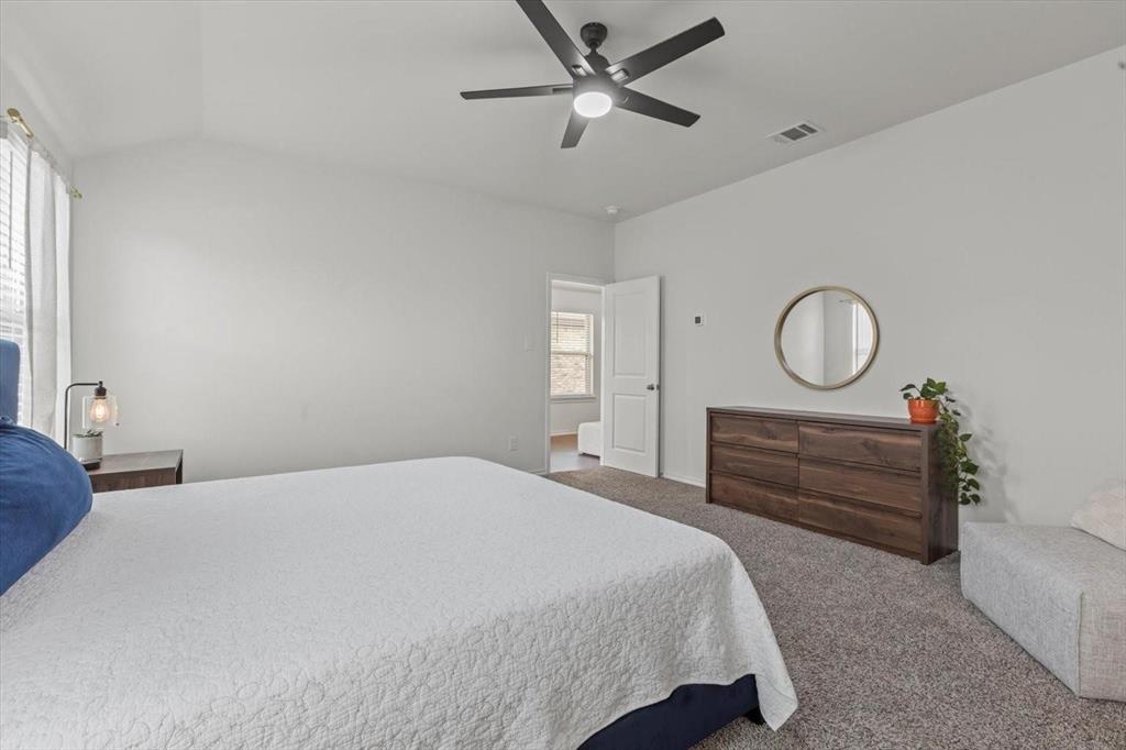 113 Keller Road Royse City, TX 75189 - Photo 6 of 25 a bedroom with a bed and a chandelier