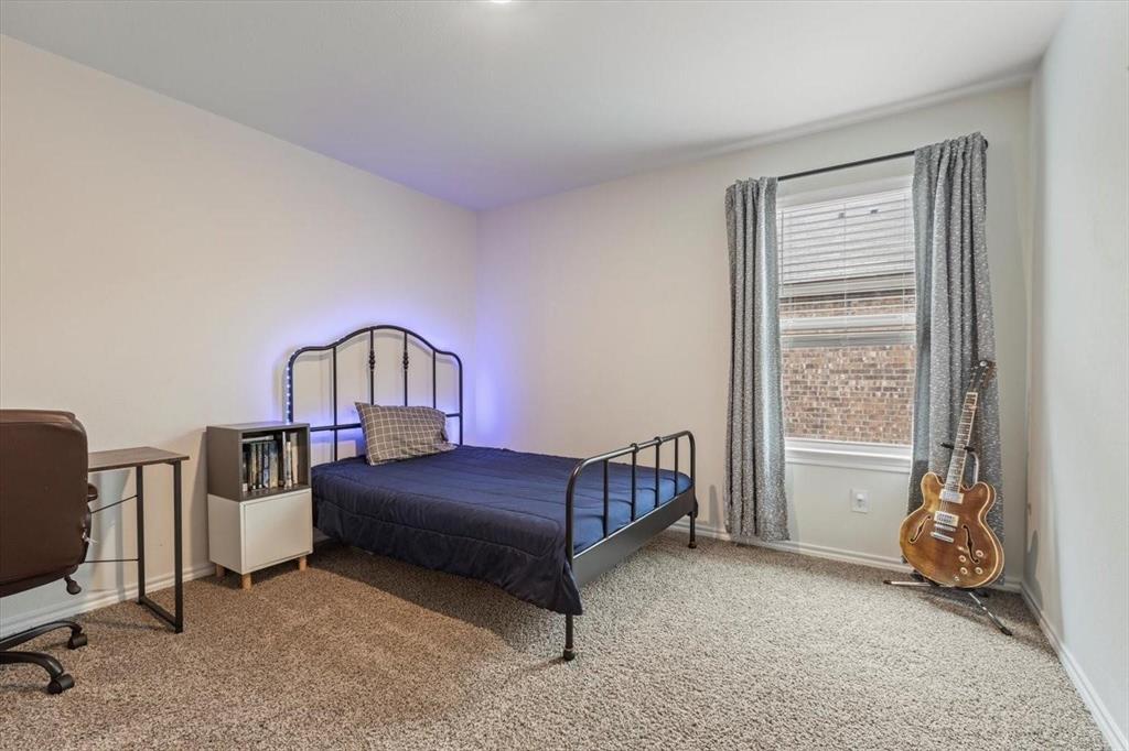113 Keller Road Royse City, TX 75189 - Photo 10 of 25 a bedroom with a bed and a window