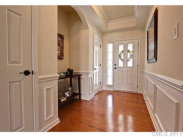 307 Wave Crest Drive, Unit 307 Tega Cay, SC 29708 - Photo 2 of 16 a view of a hallway with furniture and a window