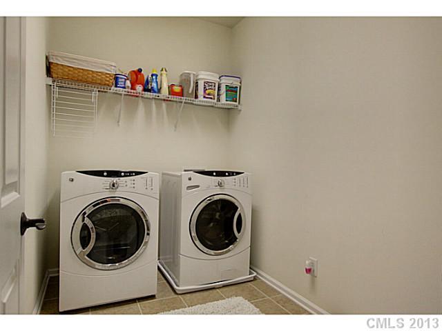 307 Wave Crest Drive, Unit 307 Tega Cay, SC 29708 - Photo 9 of 16 a utility room with dryer and washer