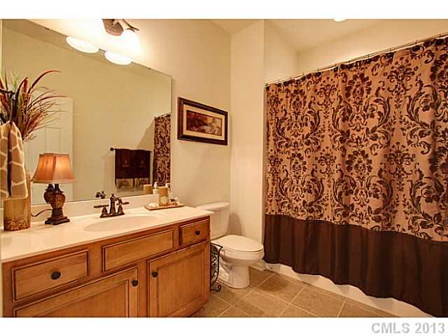 307 Wave Crest Drive, Unit 307 Tega Cay, SC 29708 - Photo 10 of 16 a bathroom with a sink and a mirror
