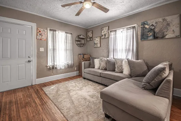 a living room with furniture and a window