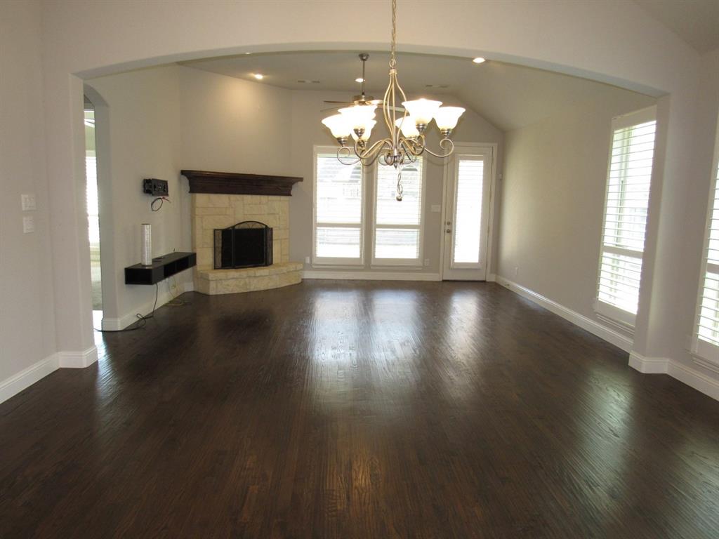 816 Pier Street Little Elm, TX 76227 - Photo 14 of 27 Unfurnished dining area featuring arched walkways, suspended lighting