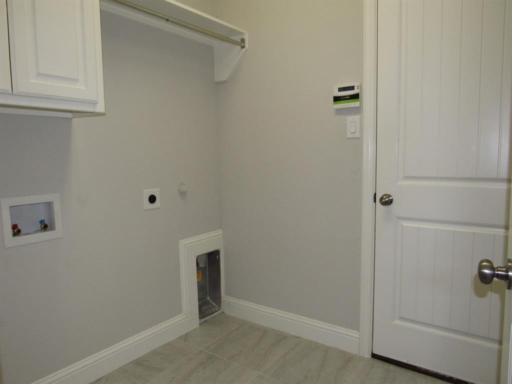 816 Pier Street Little Elm, TX 76227 - Photo 23 of 27 Laundry room with cabinet space, washer hookup, and hookup for an electric dryer