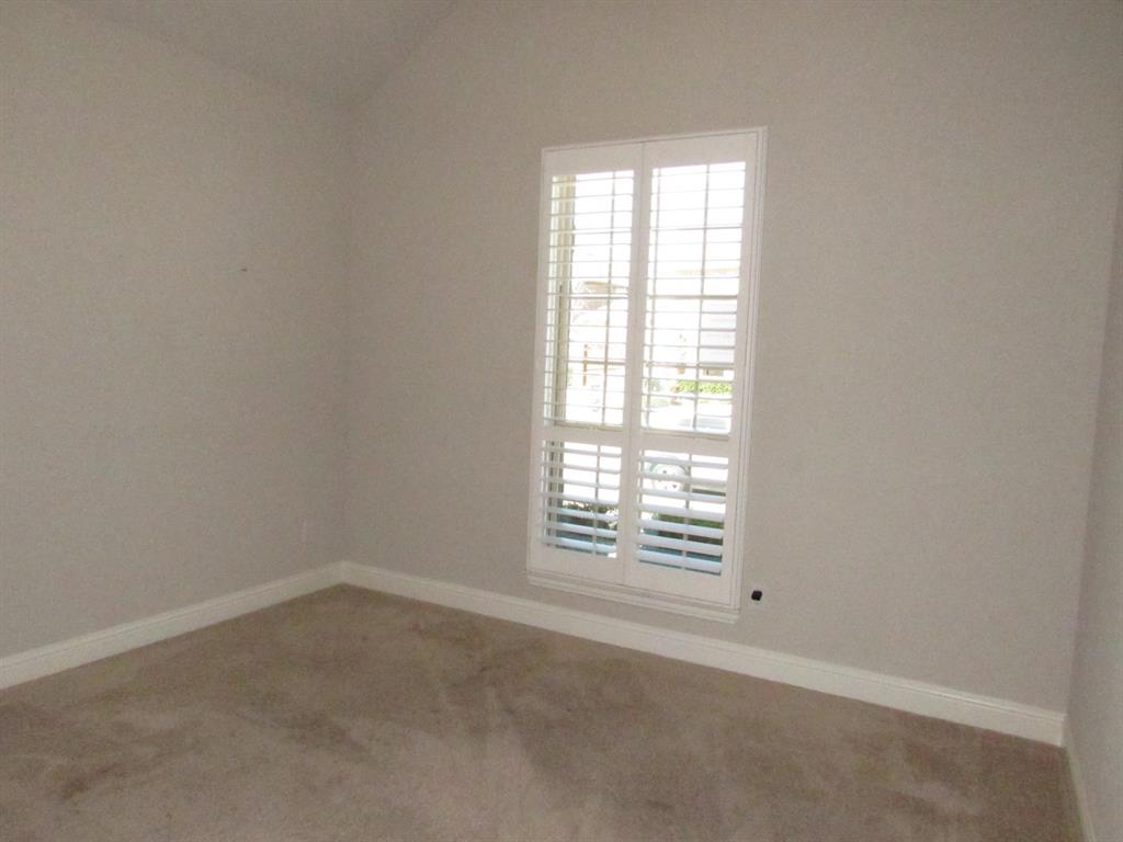 816 Pier Street Little Elm, TX 76227 - Photo 8 of 27 2nd bedroom with carpet floors and lofted ceiling
