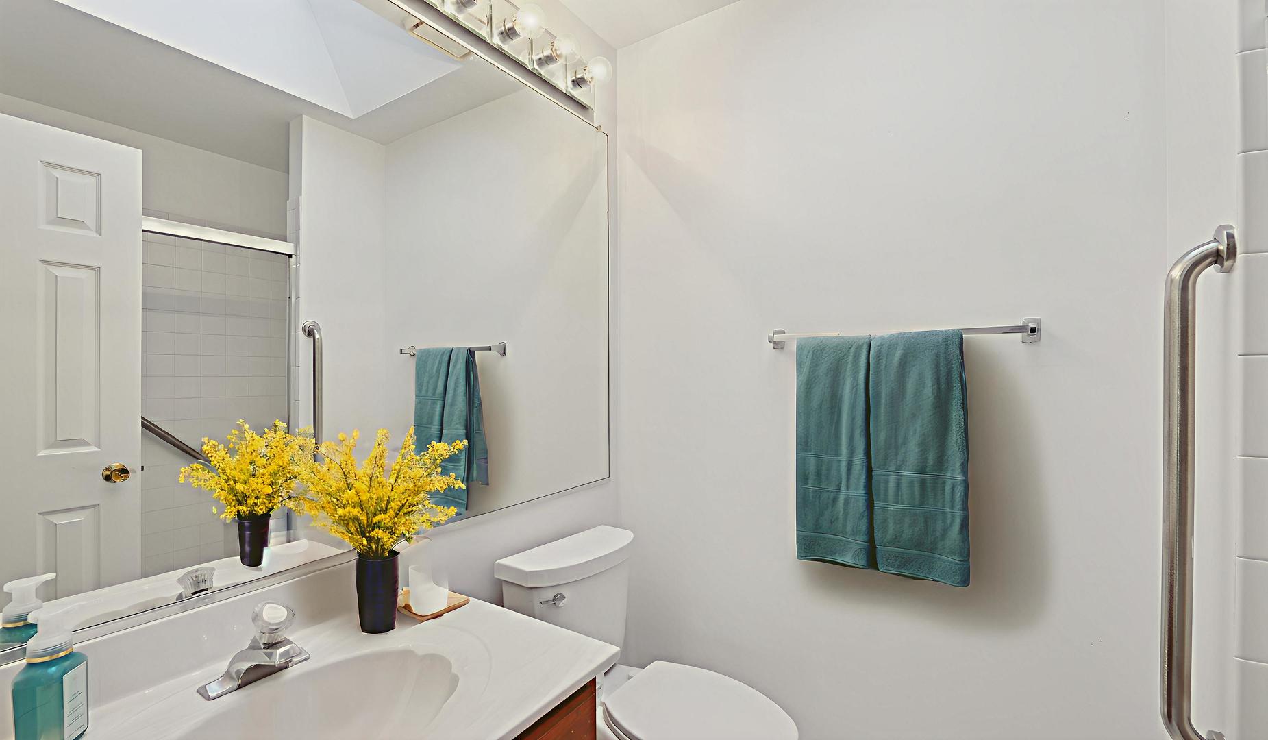 -n155 Windermere Road, Unit 1005 Winfield, IL 60190 - Photo 13 of 16 a bathroom with a sink toilet and shower