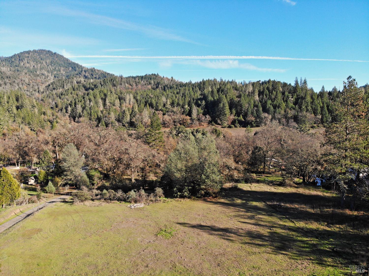 17571 Van Arsdale Road Potter Valley, CA 95469 - Photo 2 of 10 a view of a town with mountains in the background