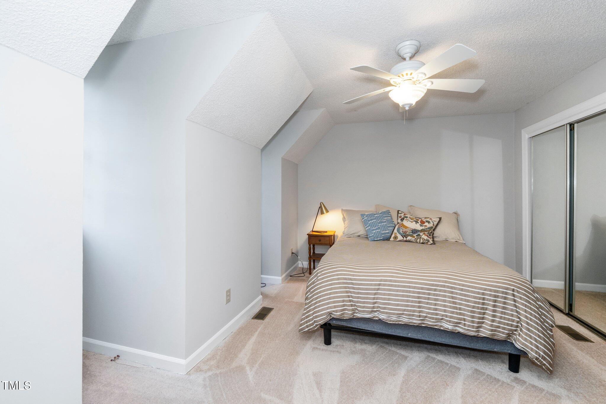 1712 Briarforest Place Raleigh, NC 27615 - Photo 28 of 55 Bedroom #3 on the second level features two dormer window and a wall of closet space.