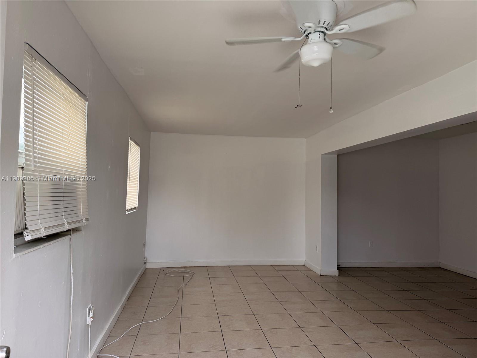 2412 Northwest 34th Street, Unit 3 Miami, FL 33142 - Photo 13 of 15 a view of an empty room with a window