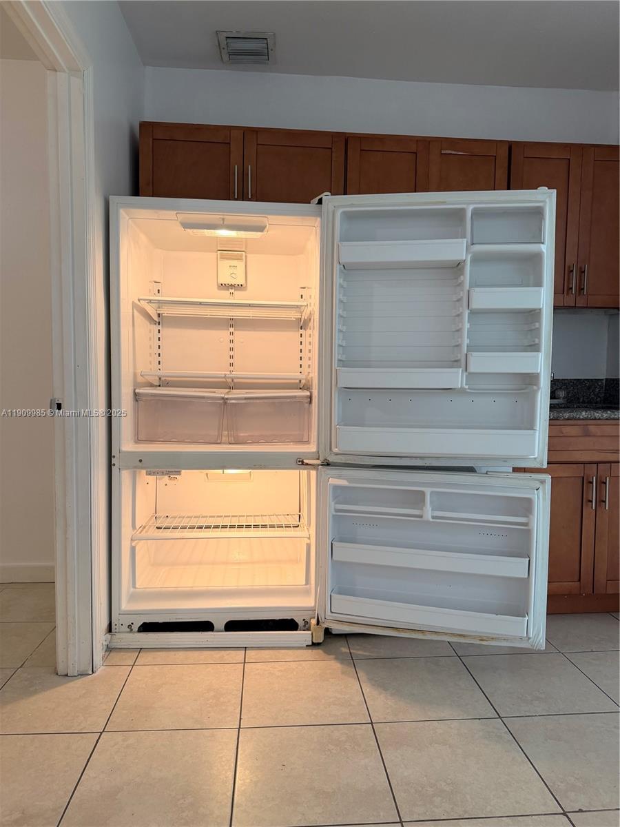 2412 Northwest 34th Street, Unit 3 Miami, FL 33142 - Photo 2 of 15 a view of walk in closet with empty racks