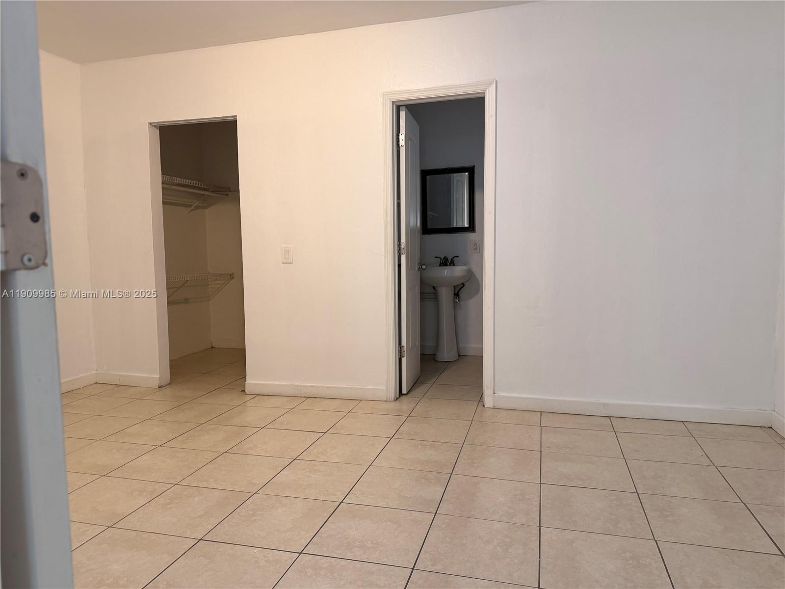 2412 Northwest 34th Street, Unit 3 Miami, FL 33142 - Photo 5 of 15 an empty room with closet