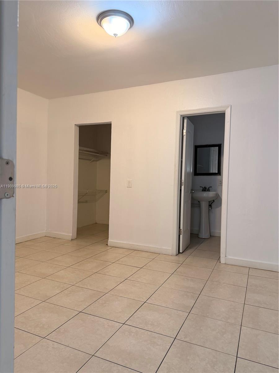 2412 Northwest 34th Street, Unit 3 Miami, FL 33142 - Photo 7 of 15 an empty room with closet