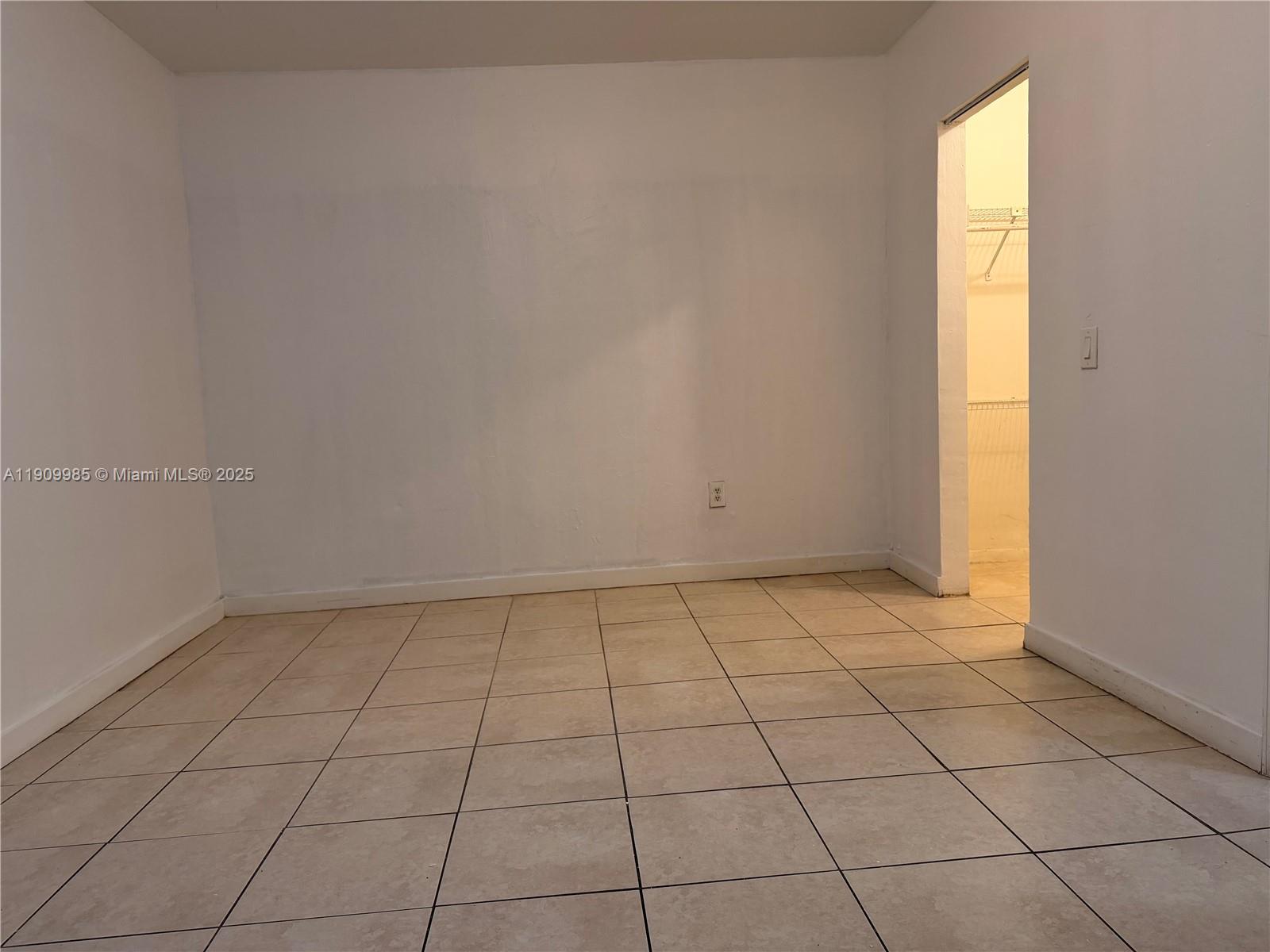 2412 Northwest 34th Street, Unit 3 Miami, FL 33142 - Photo 8 of 15 a view of an empty room and window