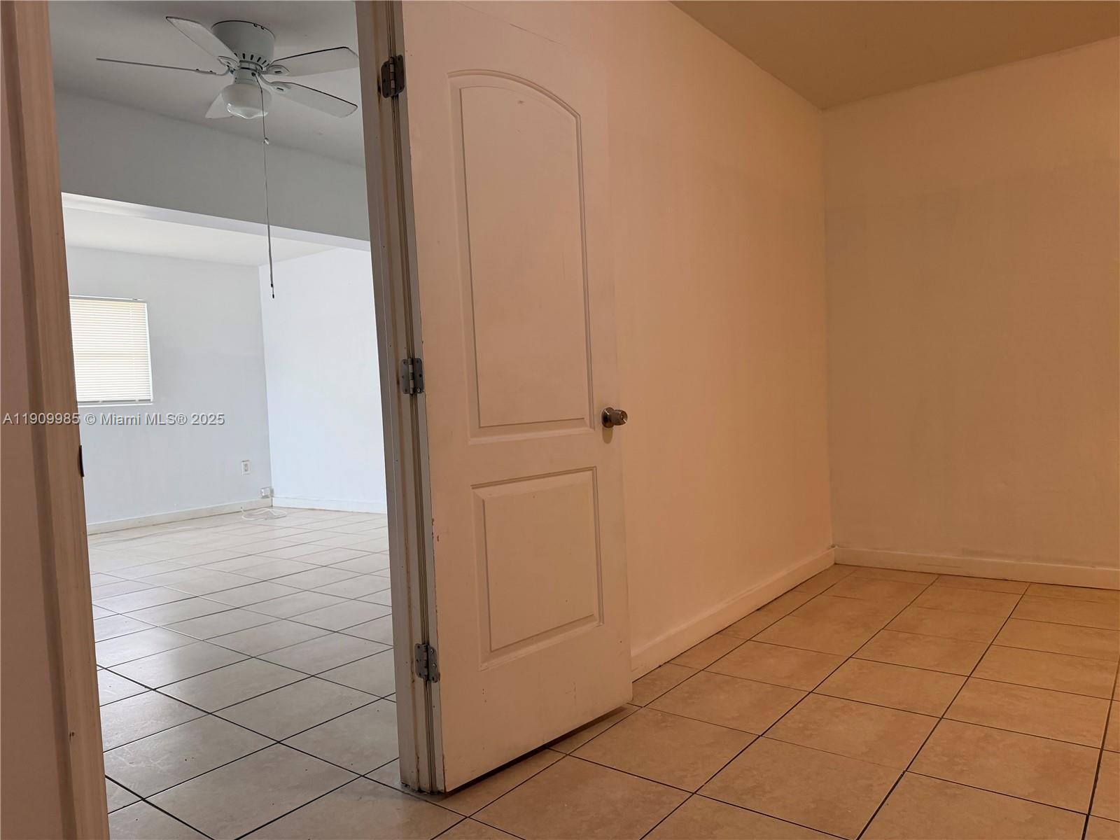 2412 Northwest 34th Street, Unit 3 Miami, FL 33142 - Photo 9 of 15 an empty room with an entryway