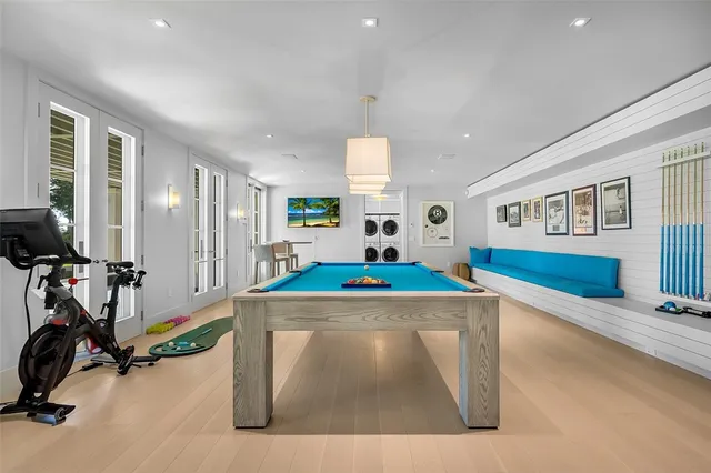 a room with gym equipment and windows