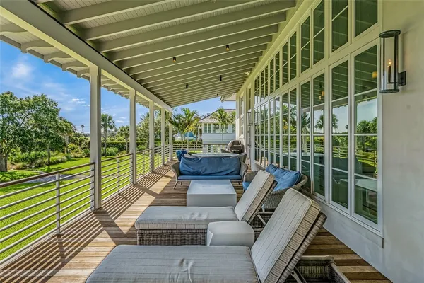 a view of sitting area with furniture and wooden deck