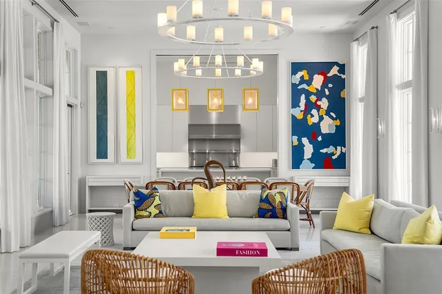 a living room with furniture and a chandelier