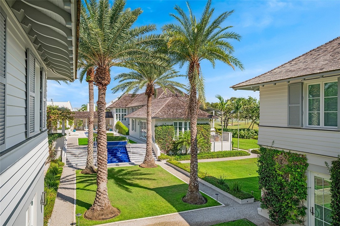 3340 Savannah Drive Vero Beach, FL 32963 - Photo 21 of 35 a view of a swimming pool with a patio and a yard