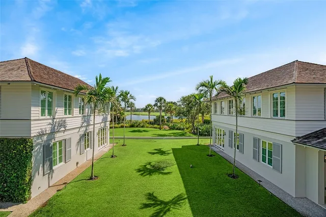 a view of an house with backyard and a garden
